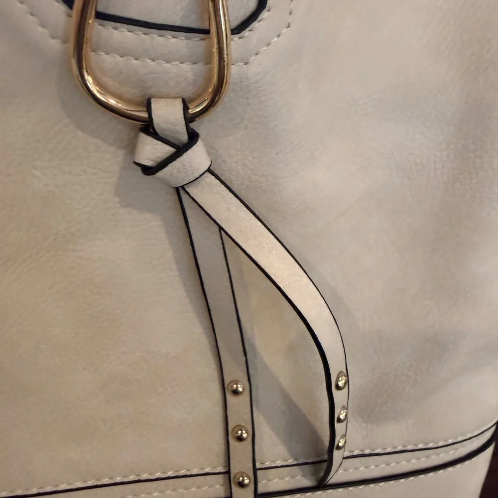 I Light colored faux leather hobo bag with gold-tone hardware like new condition
